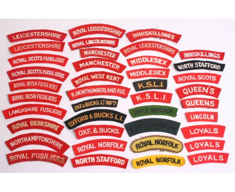 Selection of British Infantry Regiment Shoulder Titles consisting of white on red Royal Scots, white on black North Stafford,