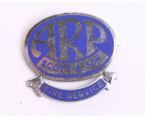 WW2 Home Front ARP Scott & Son Lapel Badge of chrome and blue enamel. Bottom of the badge has a scroll with Fire Service. Rev