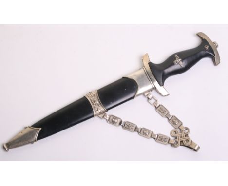 SS Officers Chained Dress Dagger with black ebony handle having eagle and rune badges inserted. Black painted scabbard with n