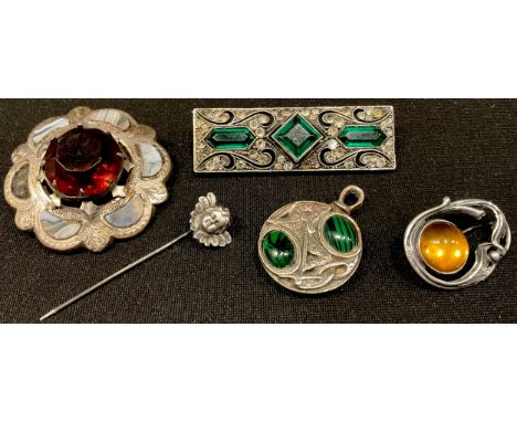 A Celtic dragon pendant; an Art Nouveau silver and amber brooch; a silver cherub stick pin; a Scottish brooch; an oblong 925 