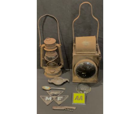 A railway carriage lantern, BRM, made in Birmingham, 44cm; a paraffin lamp; a Massy Ferguson badge; an AA badge; a DBU Kraft 