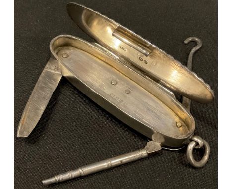 A Victorian silver reeded oval vesta case, with integral propelling pencil, steel pocket knife and button hook, suspension lo