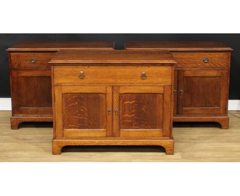 An oak side cabinet, rectangular top above a long drawer and a pair of panel doors, 78cm high, 100cm wide, 50.5cm deep; two o