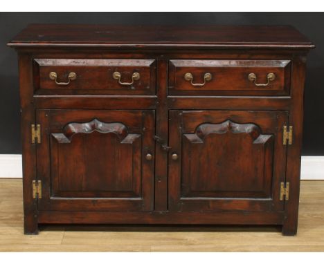 A George III Revival low dresser, rectangular top above a pair of short drawers and two raised and fielded panel doors enclos