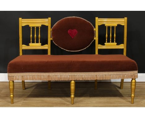 A late Victorian/Edwardian oval-centred double chair back sofa, later painted, 93.5cm high, 145cm wide, the seat 41cm deep 