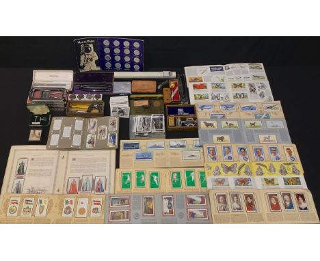A snuff box; another smaller; cut throat razors, Rolls Razor; cigarette cards; cuff links; slide rule; micrometer; Sheaffer f