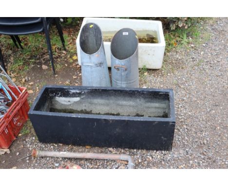 Two coal scuttles and a fibreglass planter