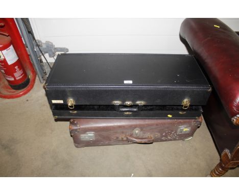 A vintage suitcase and a music case
