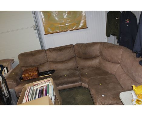 A brown upholstered corner sofa