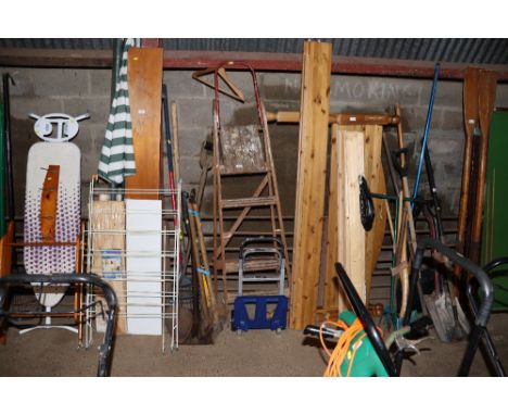 A wooden step ladder and a folding trolley