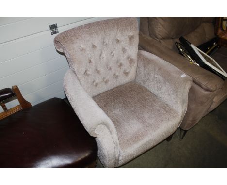 A button back upholstered armchair