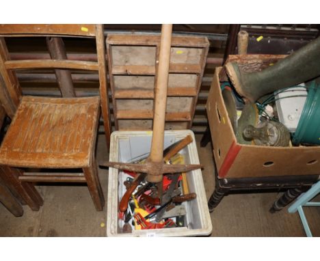 A box containing a mattock; various hand tools and a wooden tray