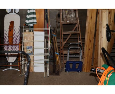 A quantity of tools to include turf spade; sledge hammer and mattock; long handled fork; turf thumper and an axe