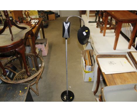An adjustable battery powered standard lamp