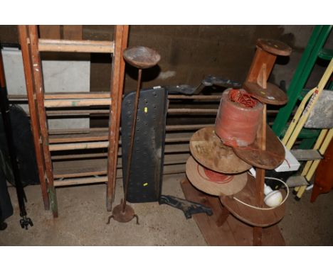 A vehicle mounted metal step and a wrought iron metal candle stand