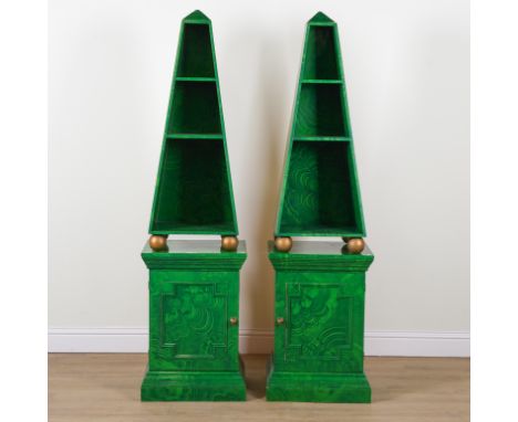 A PAIR OF FAUX MALACHITE PAINTED SIDE CABINETS (2)Each with open obelisk bookcase top, over single door base, 53cm wide; 40cm