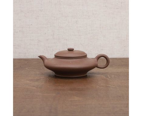 A Chinese Yixing zisha teapot, second half of the 20th century, of compressed form, inscribed with the signature of Yigong to