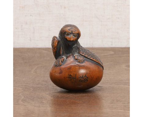 A Japanese wood netsuke, Meiji period (1868-1912), carved as an owl climbing out of a shell, signed Shigekatsu,4.5cm highCond