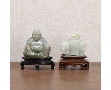 Two Chinese jade carvings, 20th century, comprising:a Budai, seated wearing a long robe exposing his bare belly, a rosary in 