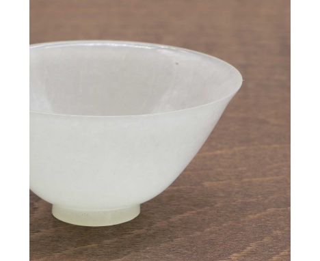 A Chinese jade teacup, Qing dynasty (1644-1911), of conical form on a circular foot, 5.5cm diameter清 玉茶杯Condition ReportA sma