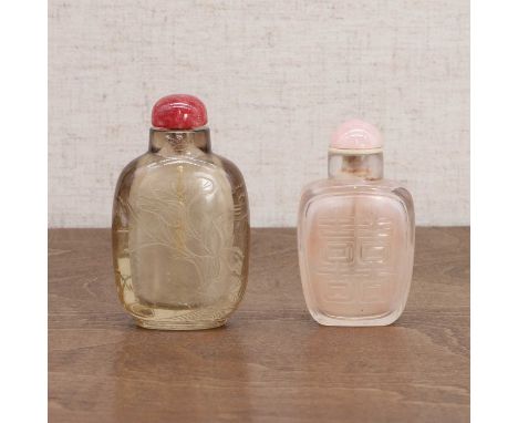 Two Chinese Peking glass snuff bottles,  Qing dynasty (1644-1911), comprising: one in light brown, carved with a lotus pond t