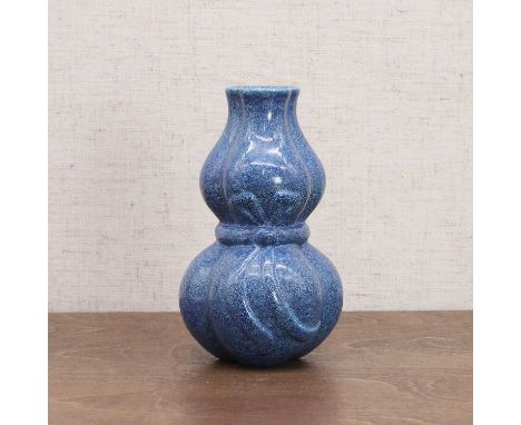 A Chinese robin's-egg glazed double gourd vase, Republic period (1912-1949), formed in three lobes set over a low conforming 