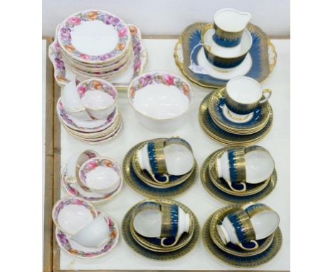 A RADFORDS BONE CHINA POWDER BLUE GROUND GILT TEA SERVICE AND A ROYAL WORCESTER FLORAL BORDER TEA SERVICE