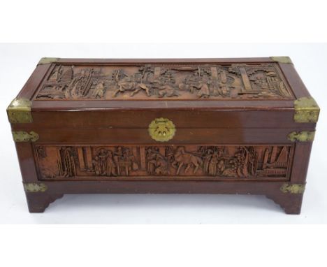 A CARVED AND BRASS MOUNTED CAMPHOR WOOD TRUNK, 120CM X 55CM 