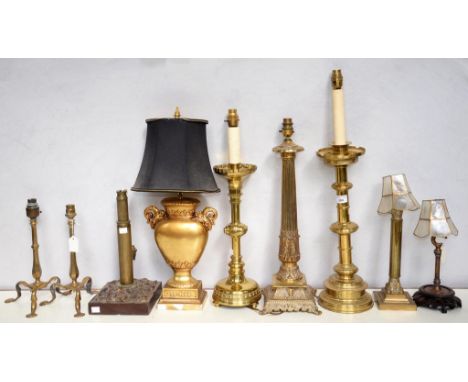 A PAIR OF BRASS TRIPOD TABLE LAMPS, 27CM EXCLUDING FITMENT AND SEVEN VARIOUS BRASS OR LAMPS, TWO IN THE FORM OF GOTHIC CANDLE