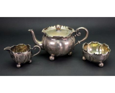 A Bachelor late 19th century three piece silver tea service, detailed 800 WTB, circular, spiral lobed and with crimped edges,
