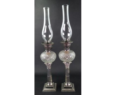 A pair of George III style electroplate Corinthian column candlesticks, late 19th century, with compressed circular cut glass