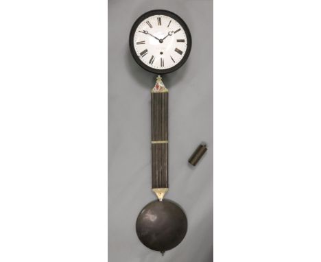 Jouanneau a St Calais; a French circular wall timepiece, 19th century, the white enamel dial with Roman numerals, with a larg