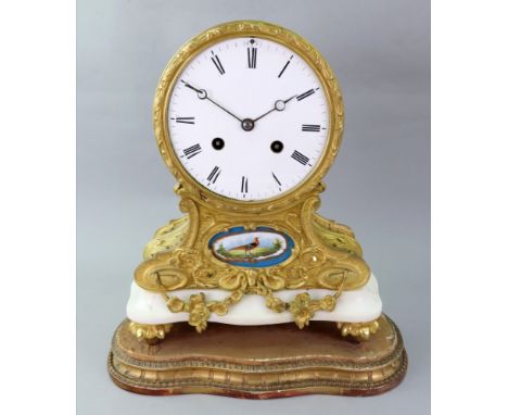 A French gilt metal mantel clock, second half 19th century, the fluted drum shape case with white enamel dial and Roman numer