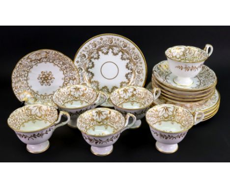 An English porcelain 18- piece tea service, probably Ridgway, decorated with a scrolling floral design, red pattern number 2/
