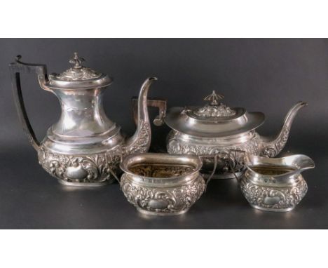 A late Victorian four piece silver tea and coffee service, Elkington & Co Ltd, Birmingham 1899, of rounded oblong form, embos