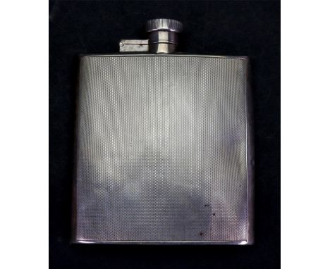 An engine turned silver hip flask, W Neale, Birmingham 1937, curved to fit the pocket, bayonet fitting cap, 4.5ozs, 11.5cm.