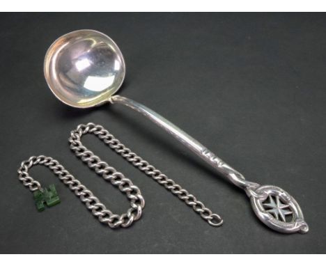 A Maltese silver sauce ladle, detailed 800, 19cm long and a silver curb link chain, graduated from the centre, hung with a gr