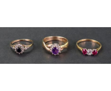 A gold, diamond and pink gemset three stone ring, the old cut diamond between two oval pink gemstones, stamped 18ct &amp; PLA