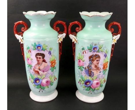 A pair of tall French porcelain two handled vases, late 19th century, each printed with a head and shoulders portrait of a yo