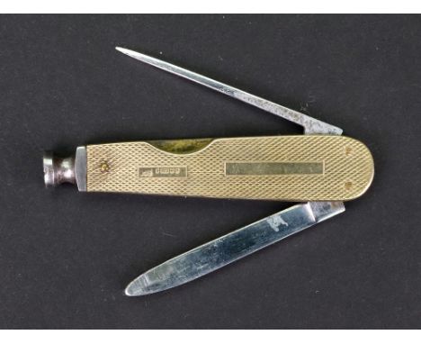 A 9ct gold mounted steel penknife, Birmingham 1964, engine turned with vacant cartouche, 7cm long.
