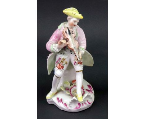 A Derby figure of a musician, circa 1758-60, modelled as a young man seated playing the violin, wearing a yellow tricorn hat,