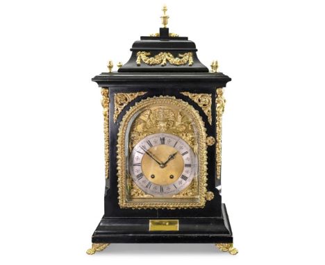 A reproduction George 1 style ebonised gilt metal mounted bracket clock, the bell top with vase turned pineapple finials and 