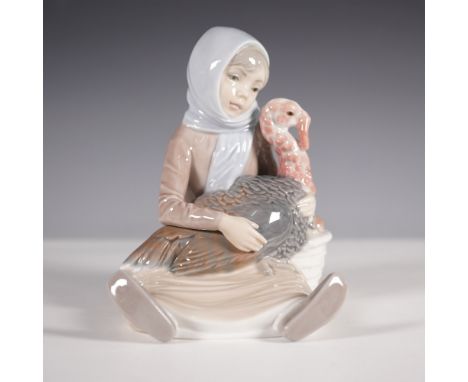 Charming Lladro porcelain figurine titled Girl with Turkey, model number 01004569. This delicately crafted piece features a y