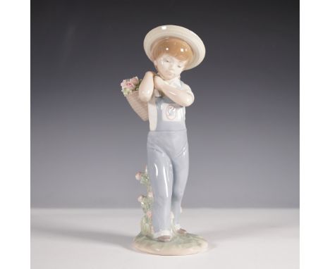 Lladro Flower Harvest figurine, model number 01001286, depicting a young boy wearing overalls and a straw hat, carrying a wov