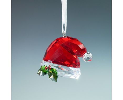 Beautifully crafted in traditional seasonal colors, it comes on a white satin ribbon. Use it to decorate your Christmas tree 