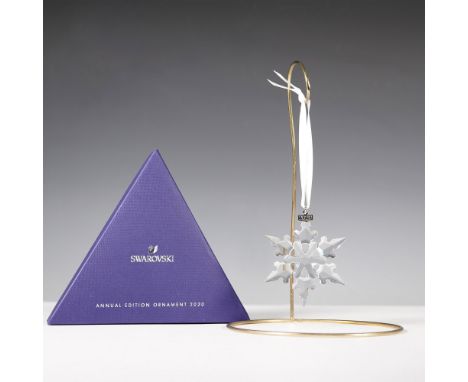 The Swarovski 2020 Annual Edition Ornament is a beautifully crafted crystal snowflake with intricate facets that reflect ligh