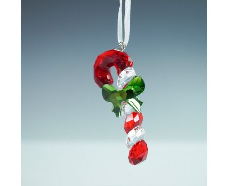 Beautifully crafted in red, green and clear crystal, it comes on a white satin ribbon. Use it to decorate your Christmas tree