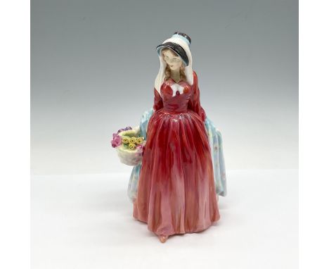 Colored in red dress with blue shawl carrying a colorful basket of flowers. Figure is part of the Harradine Classics. Royal D