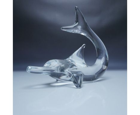 This elegant Daum crystal dolphin sculpture captures the beauty and grace of marine life in stunning detail. Crafted in Franc
