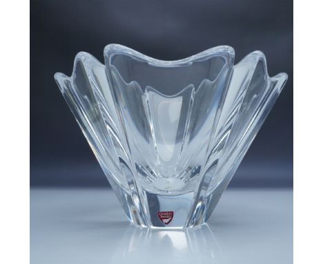 A striking Orrefors "Orion" crystal bowl designed by Lars Hellsten, crafted in Sweden. This beautiful piece features a fluted